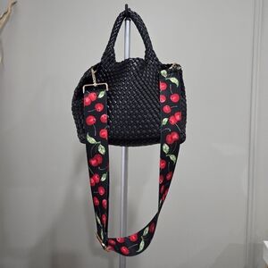 Ah Dorned Black Faux Leather Woven Hand Bag with Cherry-Print Strap